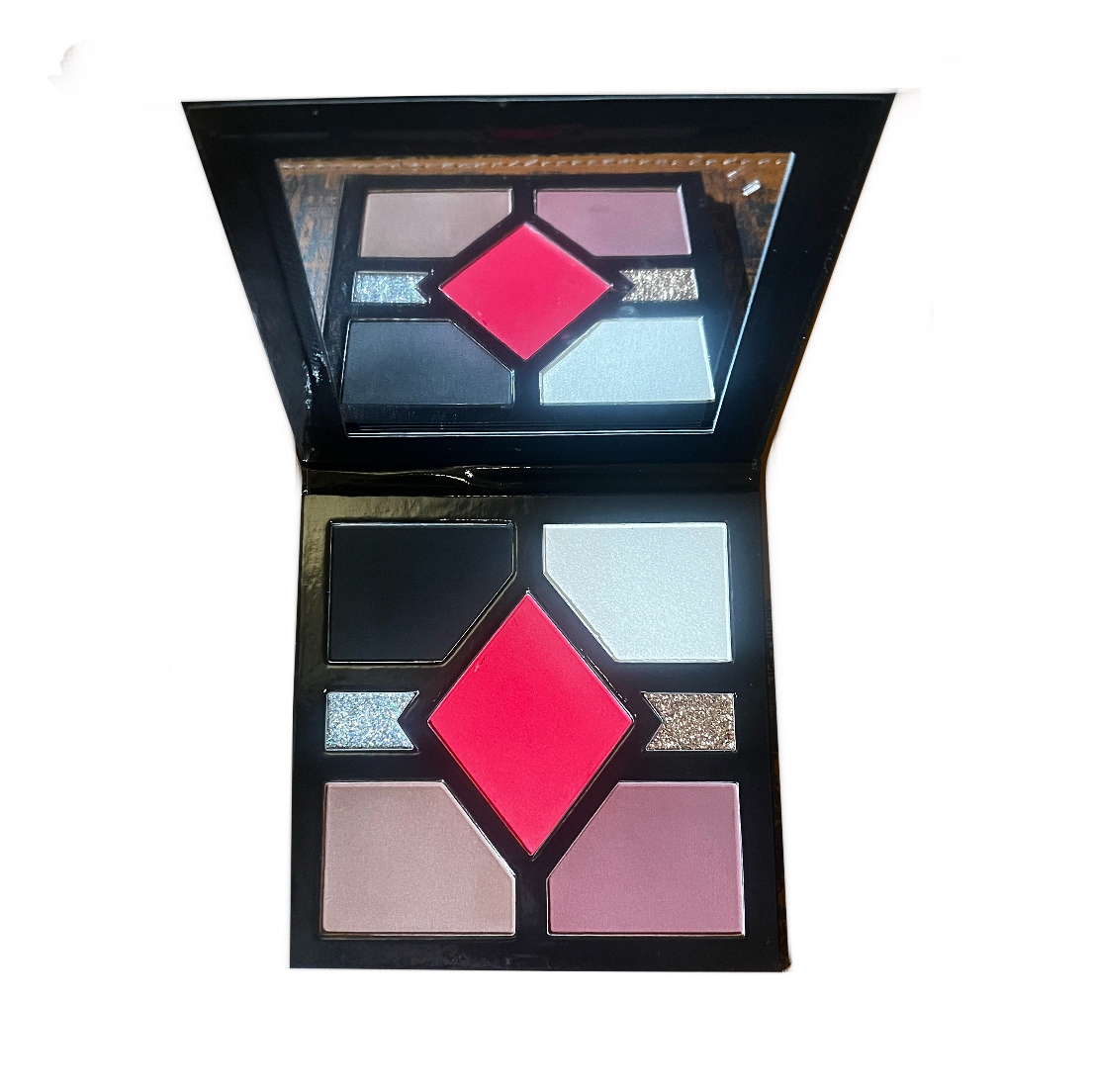 Makeup palette with various colors on a white background