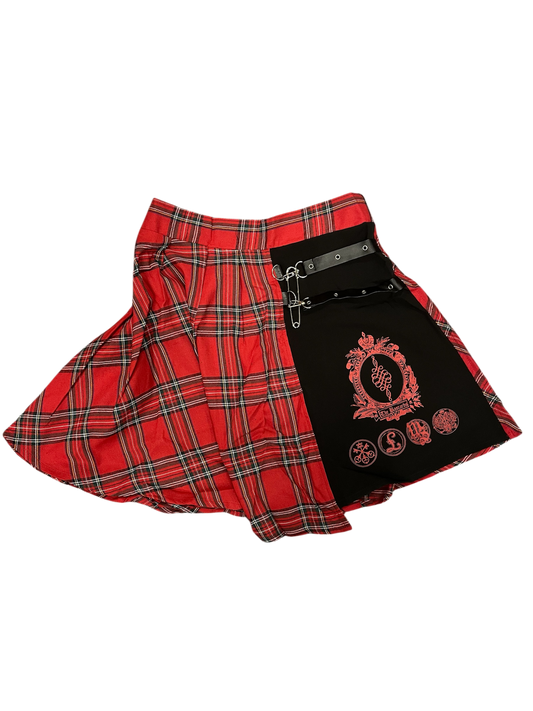 Red plaid skirt with black side panel featuring a logo on a white background