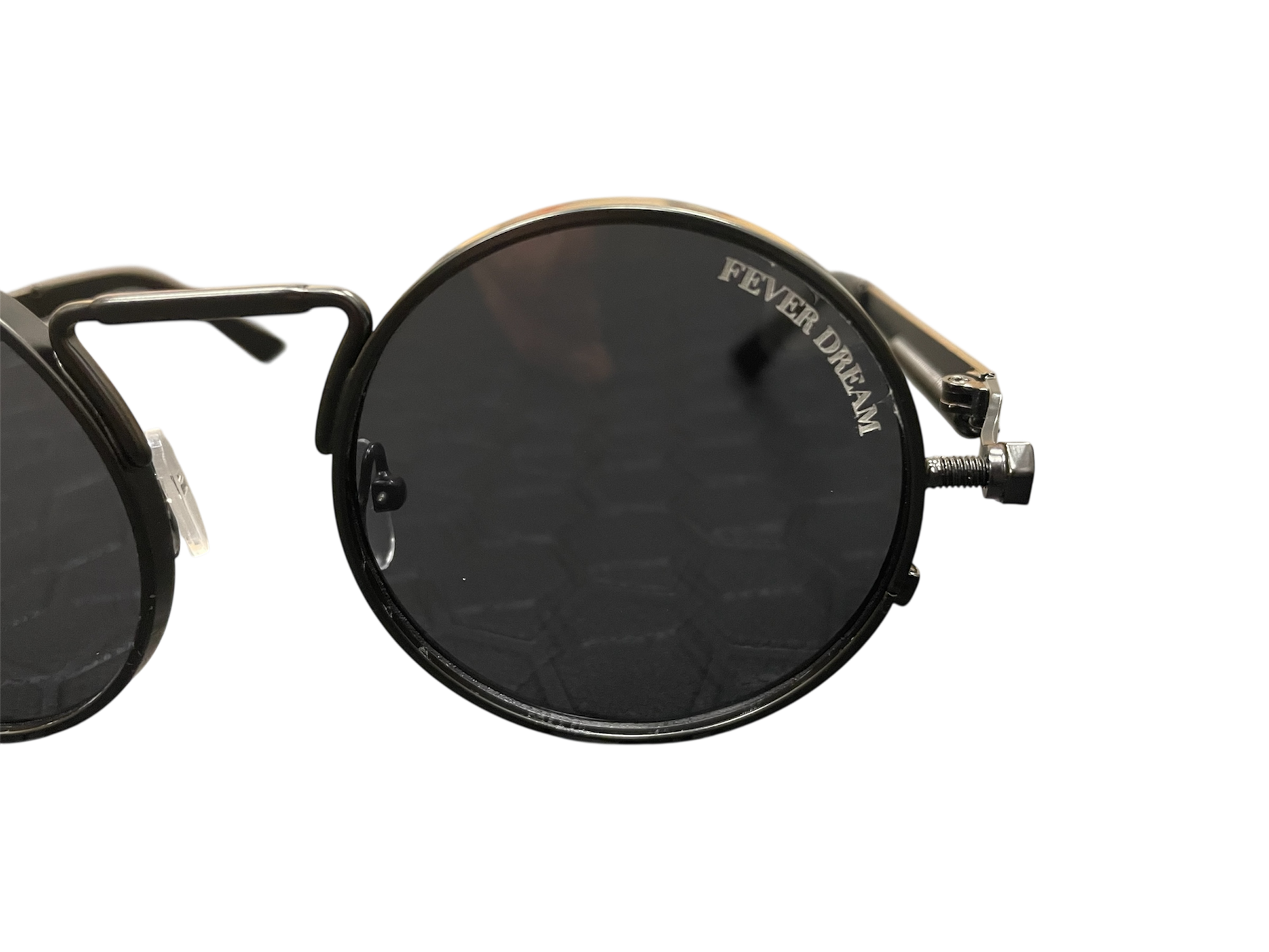 Round sunglasses with metallic frame and 'Fever Dream' branding on a white background