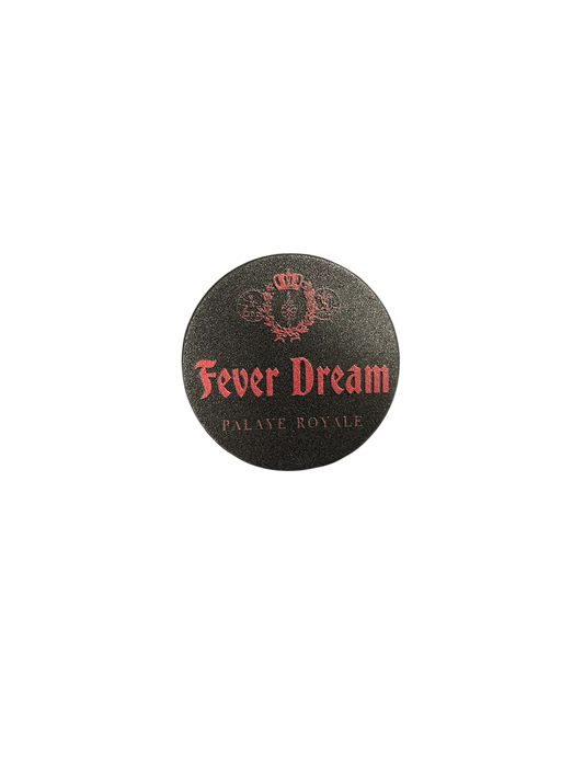 Round black product with 'Fever Dream' text on a white background