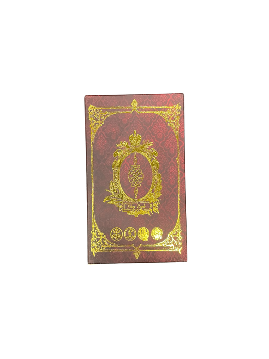 Decorative red book with gold embossed design on a white background