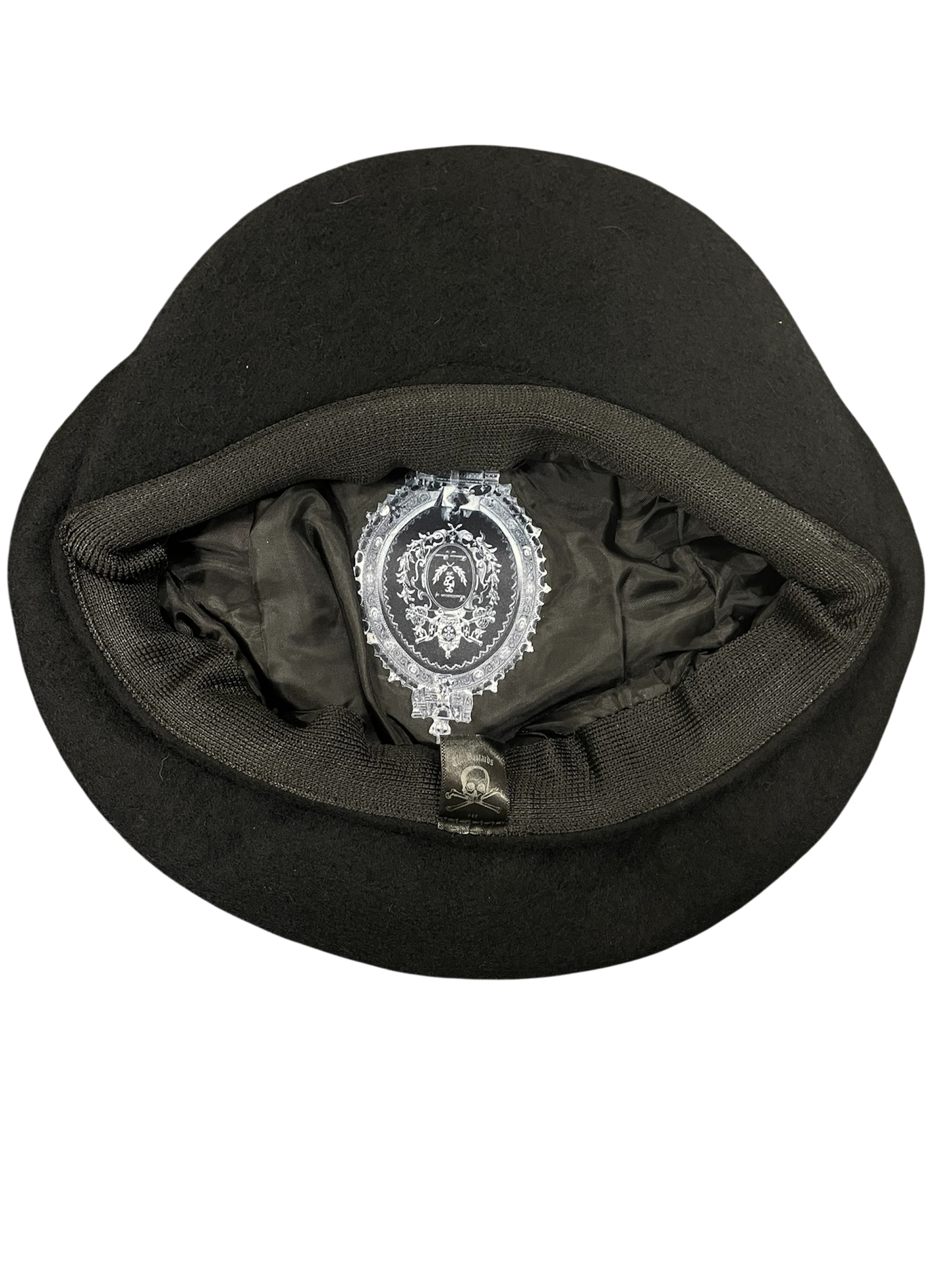 Black cap with a decorative emblem on a white background