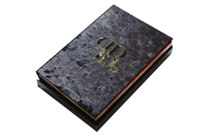 Dark textured book with gold embossed logo on a white background