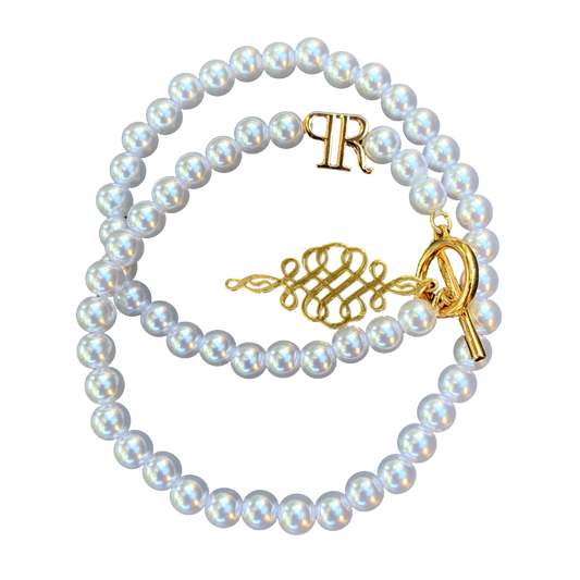 Pearl bracelet with gold charm
