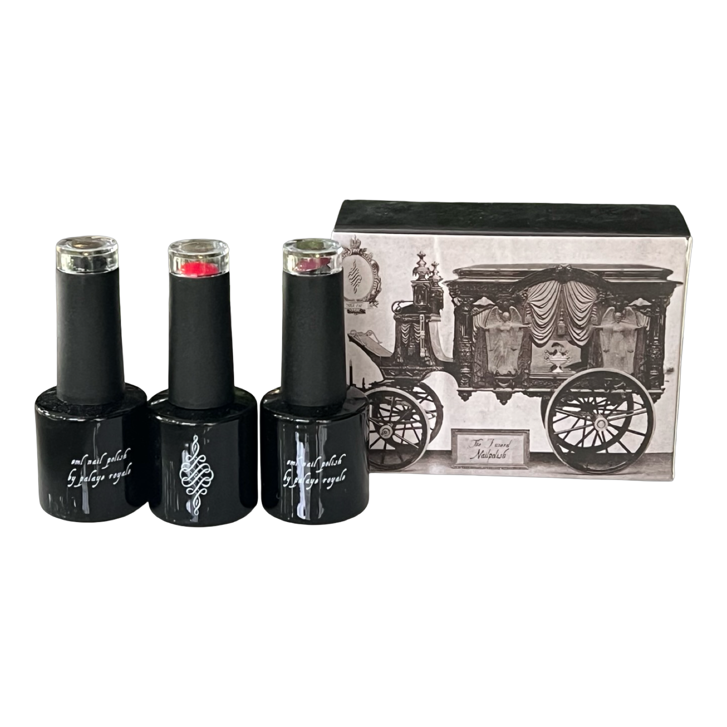 Three black nail polish bottles with a decorative box on a white background