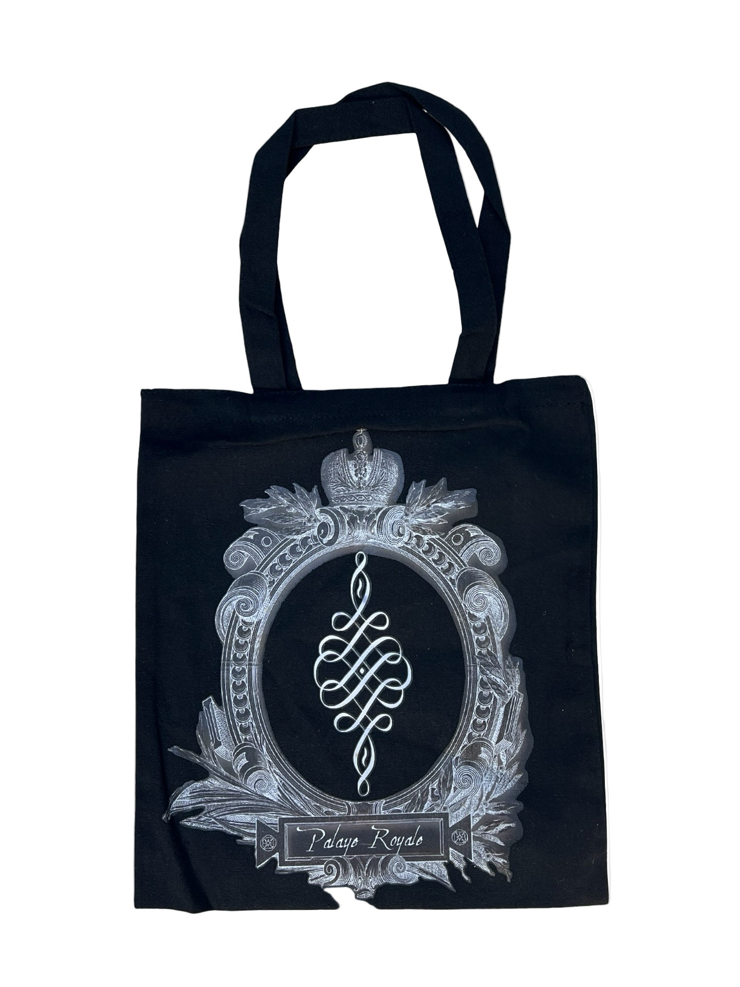 Black tote bag with decorative emblem and text on a white background