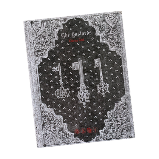 Decorative book with ornate design and keys